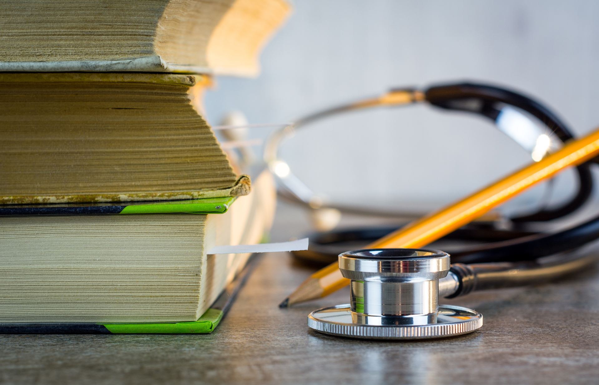 stethoscope next to a book